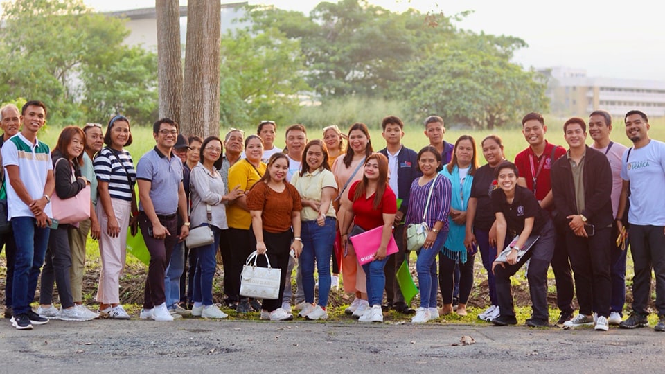 Participants, along with the facilitators, during their visit to the FMDS PERMA G.A.R.D.E.N (Growing Appreciation Towards Resilience, Development, Entrepreneurship, and Nutrition), UPOU.